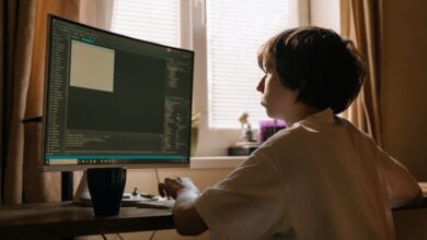 child coding on computer